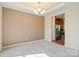 Spacious dining room with ample natural light, neutral walls, and a modern chandelier at 9618 Springholm Dr, Charlotte, NC 28278