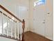 Bright entryway with wood floors, stairs to the second level, and entry door at 9618 Springholm Dr, Charlotte, NC 28278