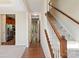 Inviting hallway with hardwood floors and neutral walls leading to the kitchen and living areas at 9618 Springholm Dr, Charlotte, NC 28278