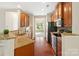 Bright kitchen with granite countertops, stainless steel appliances, and hardwood flooring at 9618 Springholm Dr, Charlotte, NC 28278