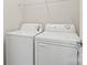 White laundry room featuring a side-by-side washing machine and dryer at 9618 Springholm Dr, Charlotte, NC 28278