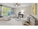Bright living room boasts ample natural light, neutral color palette, and comfortable seating arrangement at 9618 Springholm Dr, Charlotte, NC 28278