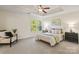 Inviting main bedroom with tray ceiling, stylish furniture, natural light creates a peaceful retreat within the home at 9618 Springholm Dr, Charlotte, NC 28278