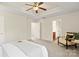 Spacious main bedroom is bathed in natural light, with a ceiling fan and plush carpeting for ultimate comfort at 9618 Springholm Dr, Charlotte, NC 28278