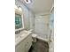 Updated bathroom featuring white subway tile shower, modern vanity, and sleek fixtures at 10805 Winterbourne Ct, Charlotte, NC 28277