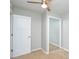 This bedroom features neutral walls, plush carpet, ceiling fan, and closet at 10805 Winterbourne Ct, Charlotte, NC 28277