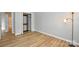 Bright bedroom with wood floors, closet, and ample natural light at 10805 Winterbourne Ct, Charlotte, NC 28277