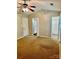 Large bedroom with carpet, ceiling fan and en suite bathroom at 10805 Winterbourne Ct, Charlotte, NC 28277