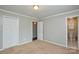 Bedroom with closet and an open doorway to an ensuite bathroom at 10805 Winterbourne Ct, Charlotte, NC 28277