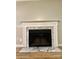 Living room fireplace with decorative mantel and marble surround at 10805 Winterbourne Ct, Charlotte, NC 28277