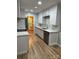 Fully updated kitchen with stainless appliances, marble backsplash, and ample counterspace at 10805 Winterbourne Ct, Charlotte, NC 28277
