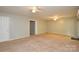 Spacious living room with a sliding door to the backyard at 10805 Winterbourne Ct, Charlotte, NC 28277