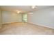 Spacious living room with a sliding door to the backyard and a modern air conditioner unit at 10805 Winterbourne Ct, Charlotte, NC 28277