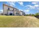 Large backyard with a well-maintained lawn and a black iron fence at 109 Crossvine Dr, Mooresville, NC 28117