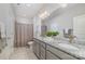This full bathroom offers double sinks, granite countertops, and tile flooring at 109 Crossvine Dr, Mooresville, NC 28117