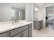 This bathroom features double sinks, neutral tile flooring, and a glass enclosed shower at 109 Crossvine Dr, Mooresville, NC 28117