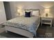 Comfortable bedroom featuring a stylish bed with side tables and lamps at 109 Crossvine Dr, Mooresville, NC 28117