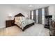 This primary bedroom features a ceiling fan, plush rug, and lots of natural light at 109 Crossvine Dr, Mooresville, NC 28117