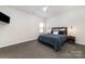 Relaxing bedroom with a TV, ceiling fan, and window for natural light at 109 Crossvine Dr, Mooresville, NC 28117