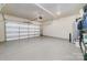 This garage features an epoxy floor, overhead storage, and an automatic door at 109 Crossvine Dr, Mooresville, NC 28117
