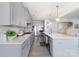 Stylish kitchen features gray cabinets, white countertops, stainless steel appliances, and ample counter space at 109 Crossvine Dr, Mooresville, NC 28117