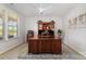 Bright office space with a large wooden desk, built in bookcase, and natural light at 109 Crossvine Dr, Mooresville, NC 28117