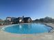 Community pool with a clubhouse in the background at 109 Crossvine Dr, Mooresville, NC 28117