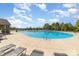 Community pool with lounge chairs and tables for relaxation at 109 Crossvine Dr, Mooresville, NC 28117