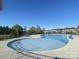Community pool with lounge chairs in the background and a view of neighborhood homes at 109 Crossvine Dr, Mooresville, NC 28117