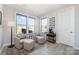 Cozy sitting area with comfortable armchairs, natural light, and a view of the backyard at 109 Crossvine Dr, Mooresville, NC 28117