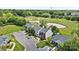 Aerial view of townhomes backing to a pond and golf course at 10942 Winterbourne Ct, Charlotte, NC 28277