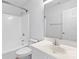 Clean bathroom featuring a shower-tub, toilet, and vanity with mirror at 10942 Winterbourne Ct, Charlotte, NC 28277