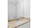 Bright bathroom featuring a granite countertop and large mirror at 10942 Winterbourne Ct, Charlotte, NC 28277