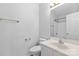Clean bathroom featuring white fixtures, a shower-tub, and a large mirror at 10942 Winterbourne Ct, Charlotte, NC 28277