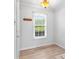Bright entryway with a coat rack and window with view to outdoor greenery at 10942 Winterbourne Ct, Charlotte, NC 28277