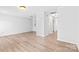 Spacious living room with hardwood floors and neutral decor, offering versatile layout at 10942 Winterbourne Ct, Charlotte, NC 28277