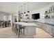 Modern kitchen with island, bar seating and stainless steel appliances at 1107 Meander Ln, Waxhaw, NC 28173