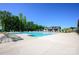 Large community pool surrounded by lounge chairs and lush landscaping at 1107 Meander Ln, Waxhaw, NC 28173