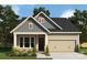 Charming craftsman-style home with a two-car garage, lovely landscaping, and eye-catching architectural details at 1107 Meander Ln, Waxhaw, NC 28173