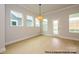 Bright living room featuring large windows, a glass patio door, and hardwood floors at 1107 Meander Ln, Waxhaw, NC 28173