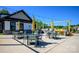 Outdoor patio area featuring BBQ, tables, chairs, and decorative string lights at 1107 Meander Ln, Waxhaw, NC 28173