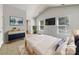 Bright bedroom with vaulted ceilings, large windows, and stylish decor at 1107 Stonehenge Ln, Charlotte, NC 28216