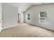 Spacious bedroom with vaulted ceilings, plush carpets, and large windows for ample natural light at 1107 Stonehenge Ln, Charlotte, NC 28216