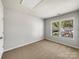 Bedroom with a carpet and a window with natural light at 1107 Stonehenge Ln, Charlotte, NC 28216