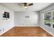 Bright living room showcases hardwood floors and neutral walls, offering a blank canvas for personalization at 1107 Stonehenge Ln, Charlotte, NC 28216