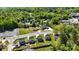 A neighborhood aerial view with nearby homes surrounded by lush greenery and a tower in the distance at 126 Newsome Rd, Salisbury, NC 28146