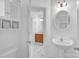 Bathroom with white cabinets, modern fixtures, and sleek marble floors at 126 Newsome Rd, Salisbury, NC 28146