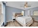 Serene bedroom with a ceiling fan, wood flooring, and a calming blue color scheme at 126 Newsome Rd, Salisbury, NC 28146
