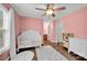 Bright bedroom features ceiling fan, white trim, wood floors and white shag rug at 126 Newsome Rd, Salisbury, NC 28146