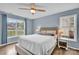 Bright bedroom with a ceiling fan, wood flooring, and a calming blue color scheme at 126 Newsome Rd, Salisbury, NC 28146